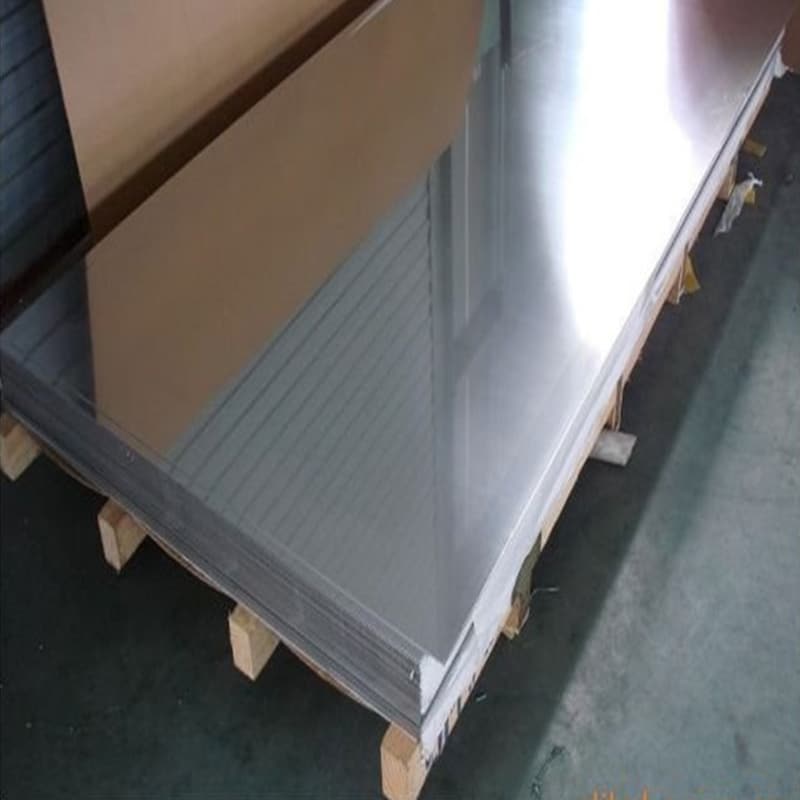 Quality control inspector verifying chemical composition on an ASTM A240 304 stainless steel plate Quality control inspector verifying chemical composition on an ASTM A240 304 stainless steel plate